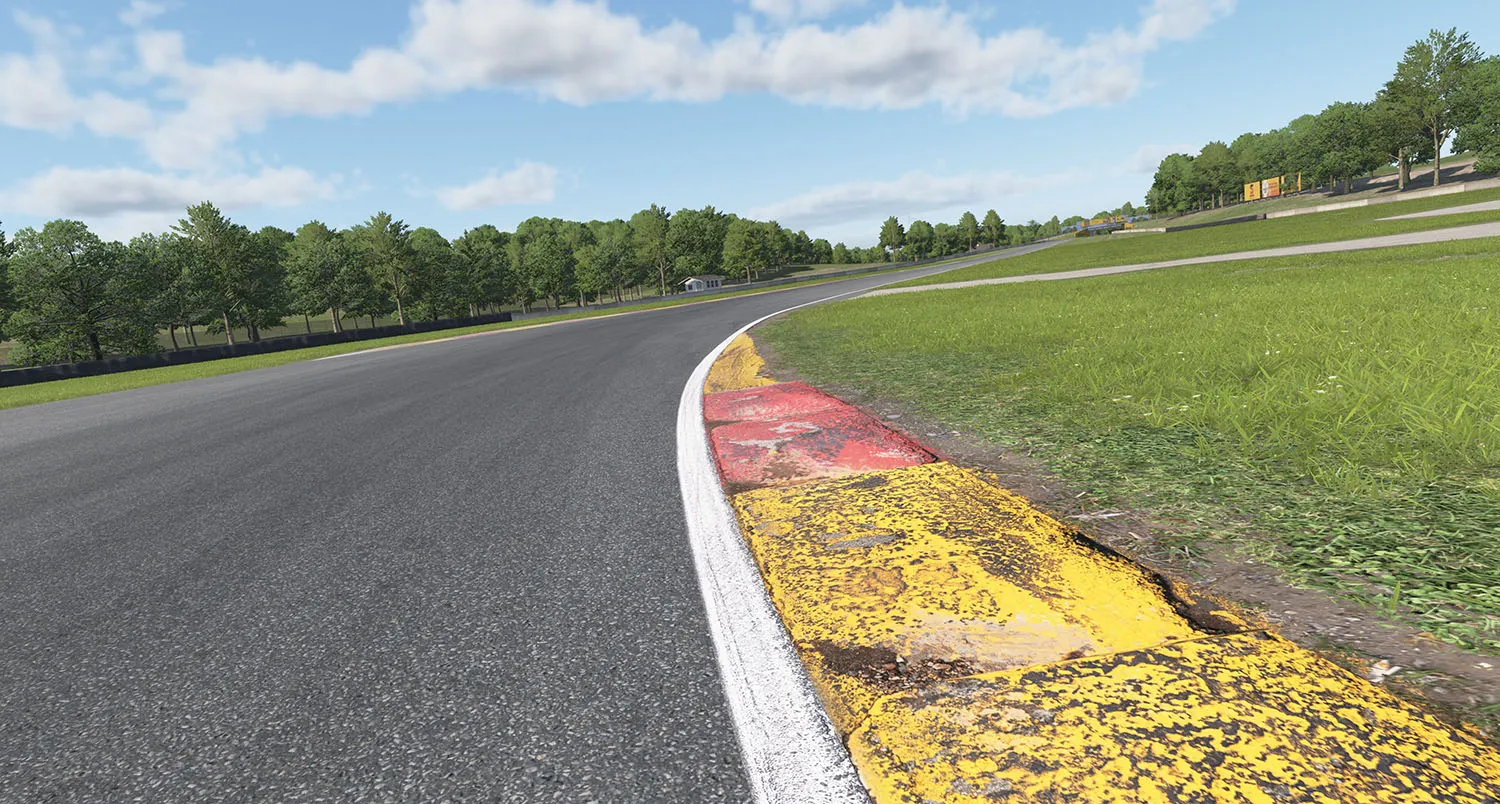 Trackside at Road America: worn red and yellow kerb, white line and asphalt
